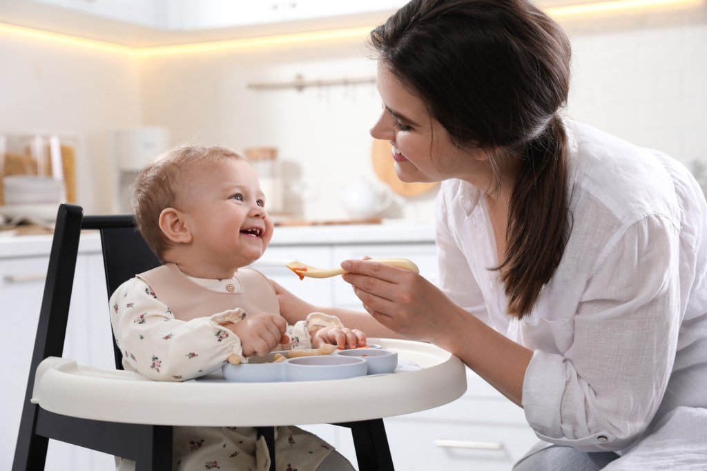 feeding baby with bib