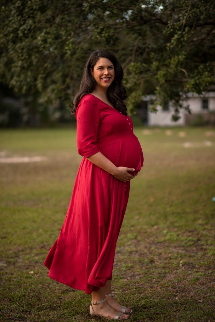 The author at her maternity photoshoot in her second pregnancy.